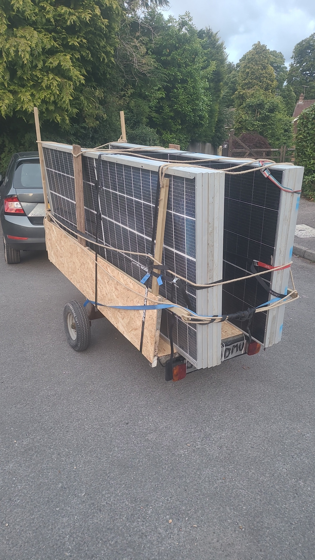 The finished trailer loaded with solar panels, strapped down and on the road
